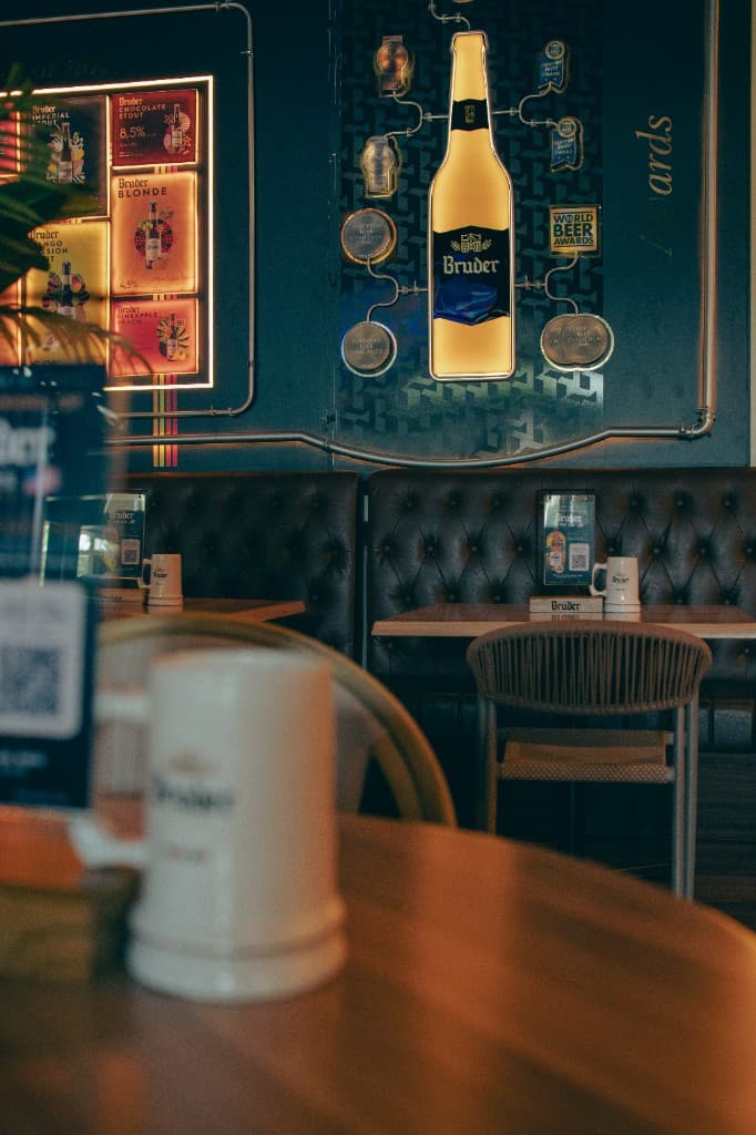 Bruder awards wall with beer menu and illuminated bottle sign